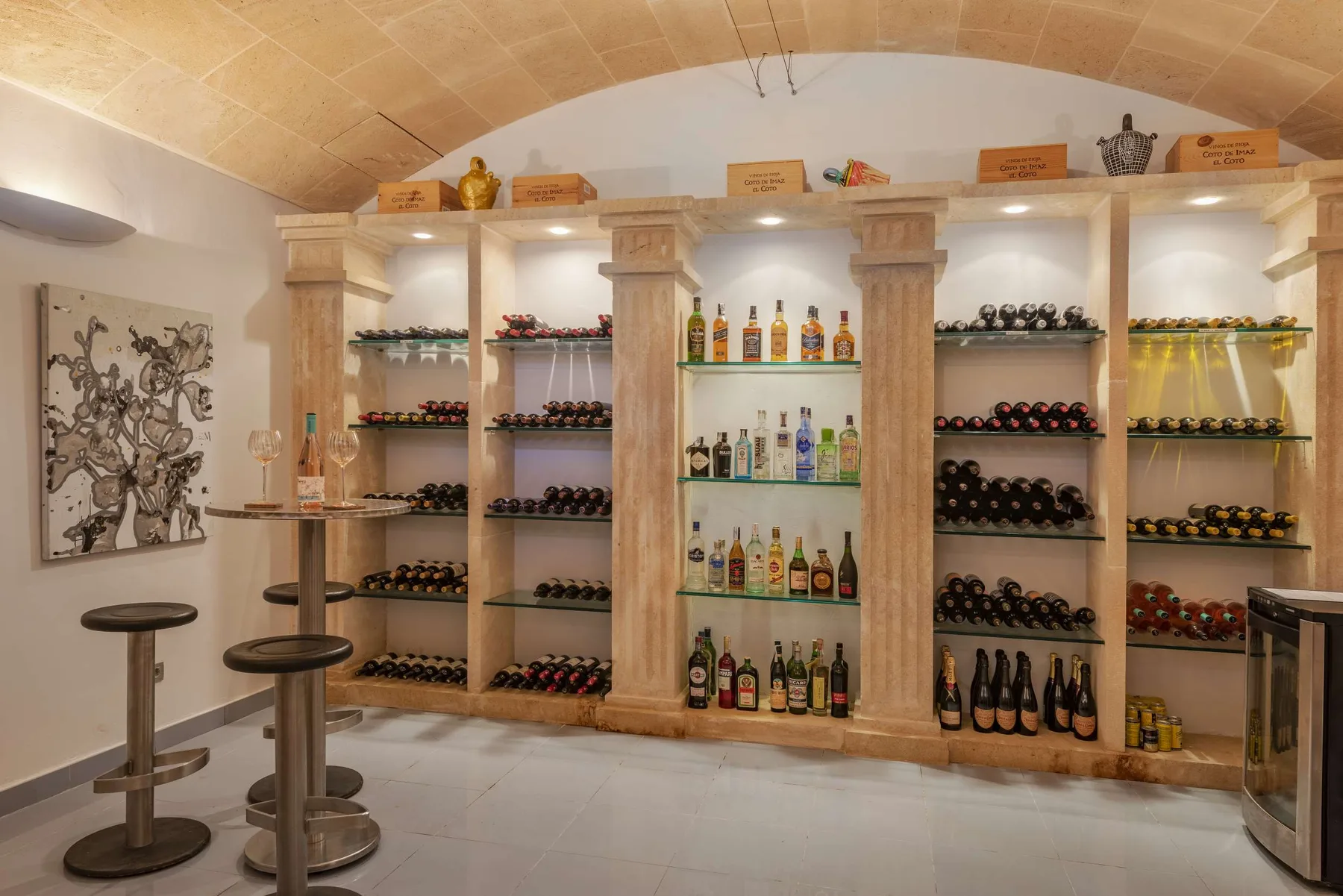 A bottle display room with shelves of wine and spirits.
