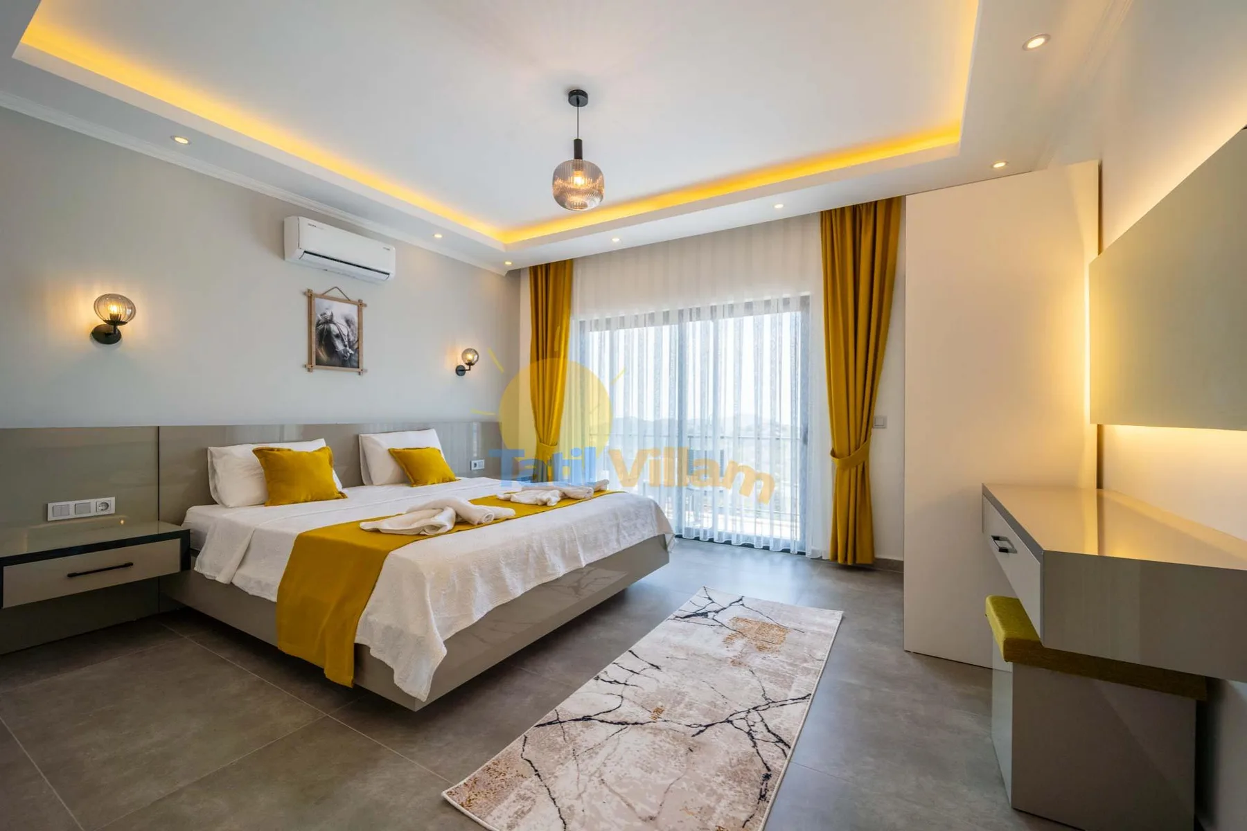 A bedroom with a bed, yellow curtains, and a bright window.