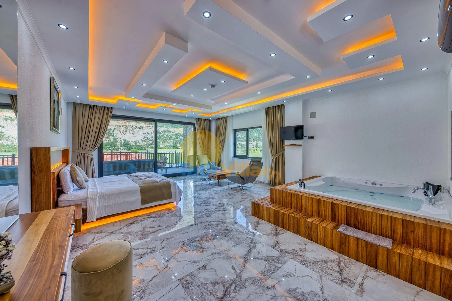 A bedroom with a bed beside a large window and a bathtub.