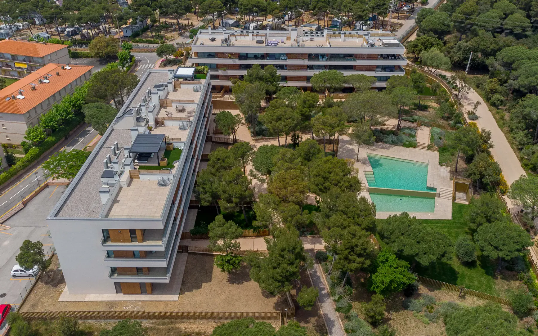 Shared amenity: An aerial view shows a residential complex with a swimming pool and landscaped grounds.