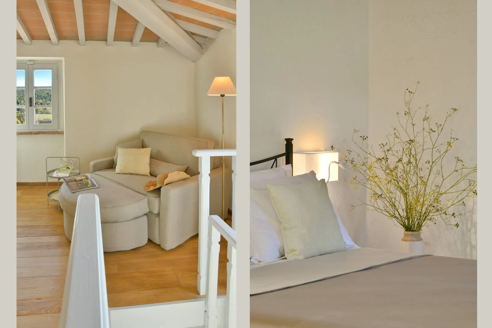 Un dormitorio luminoso con una cama, flores junto a ella y una zona de estar.