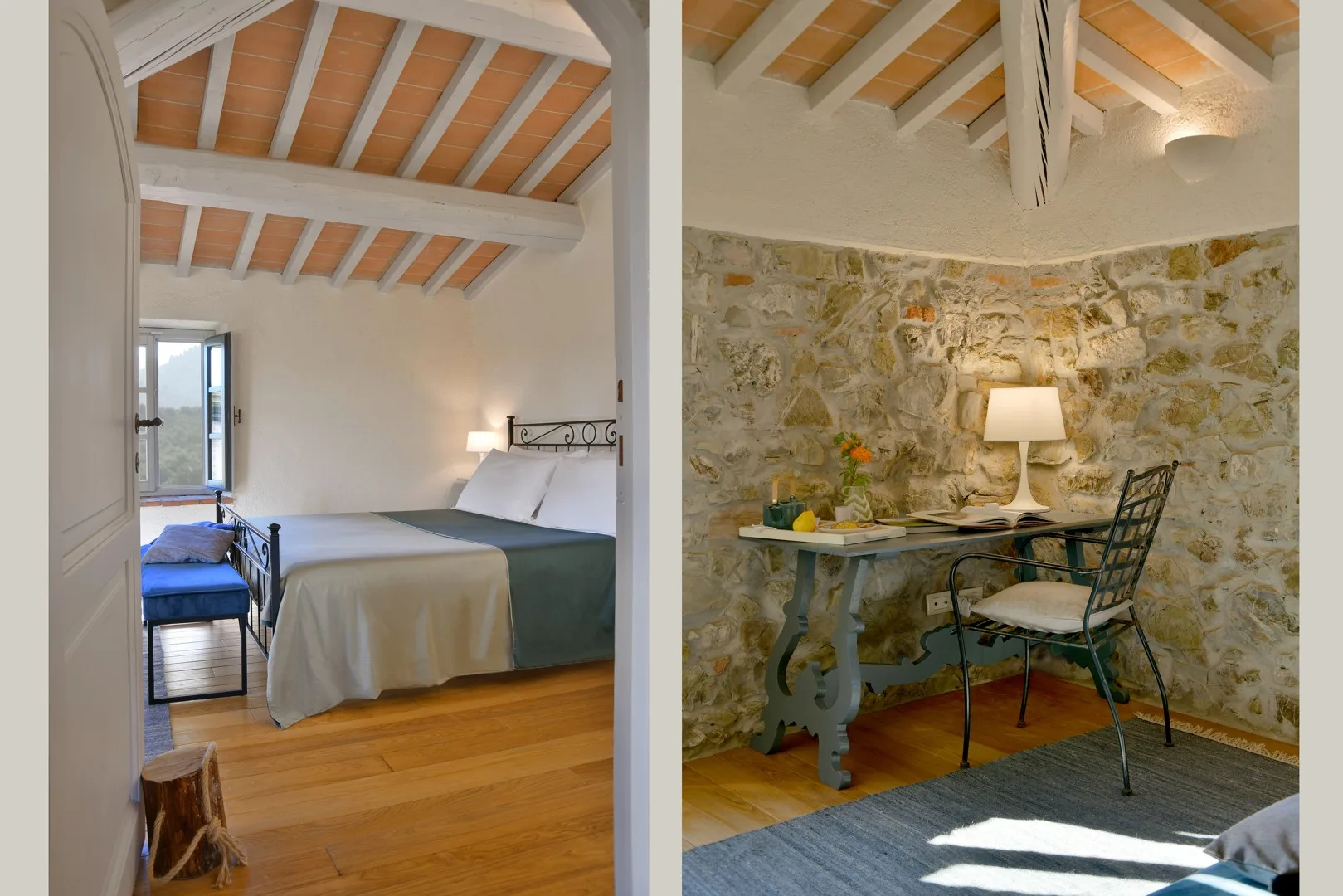 Un dormitorio con una cama y una pequeña mesa junto a paredes de piedra.