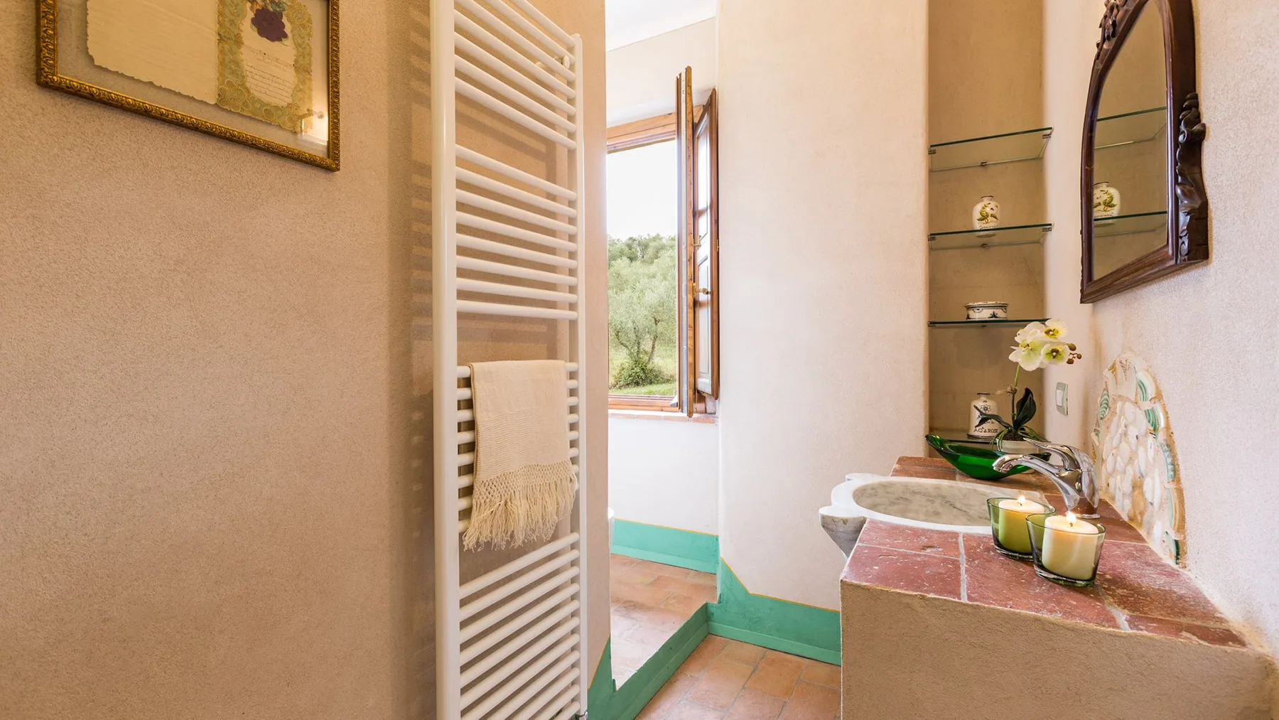 A bathroom with a sink, mirror, and open window.