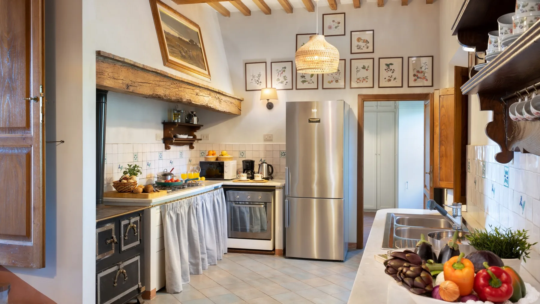 A kitchen with a stainless-steel refrigerator, countertop, and vegetables.