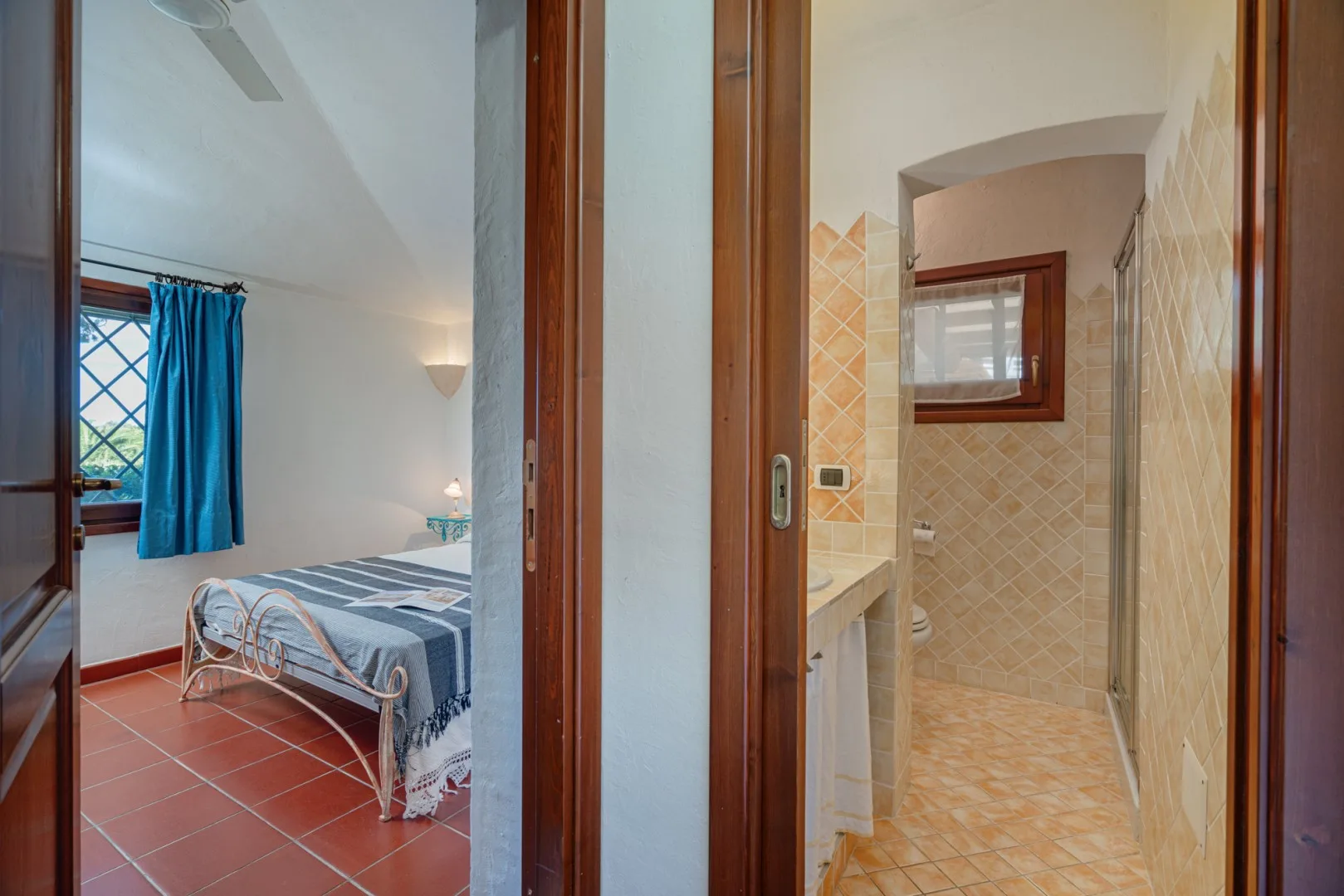 A bedroom and adjoining bathroom are visible through open doorways.
