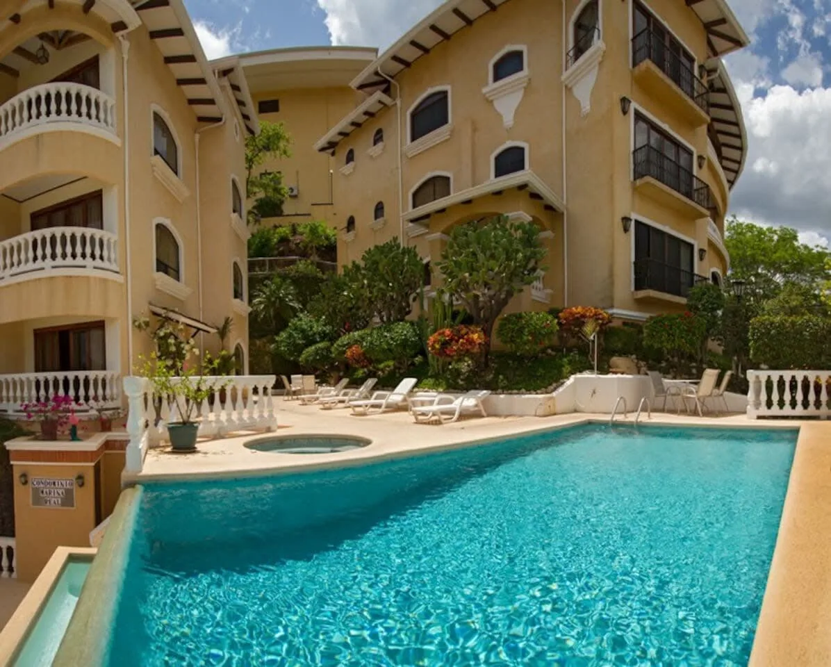 Shared amenity: An outdoor swimming pool sits beside a multi-story building.