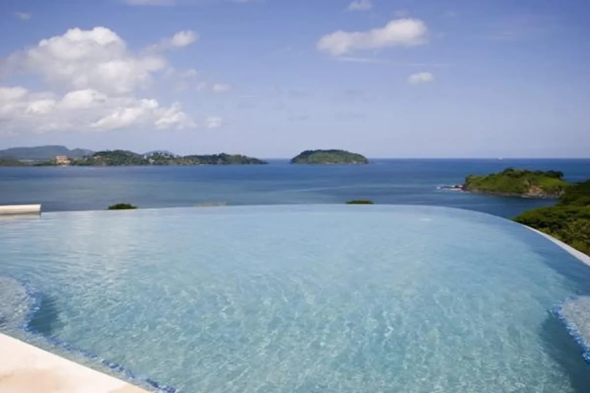 Shared amenity: An infinity pool overlooks the sea and distant islands.