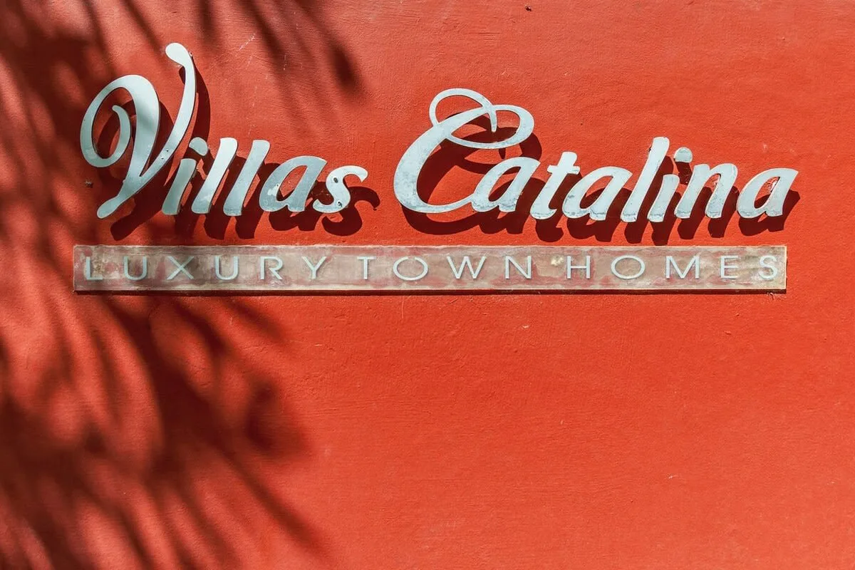 Shared amenity: A red wall displays the Villas Catalina sign.