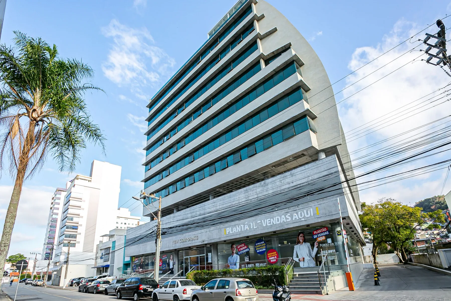 Shared amenity: A multi-story commercial building stands beside a city street.