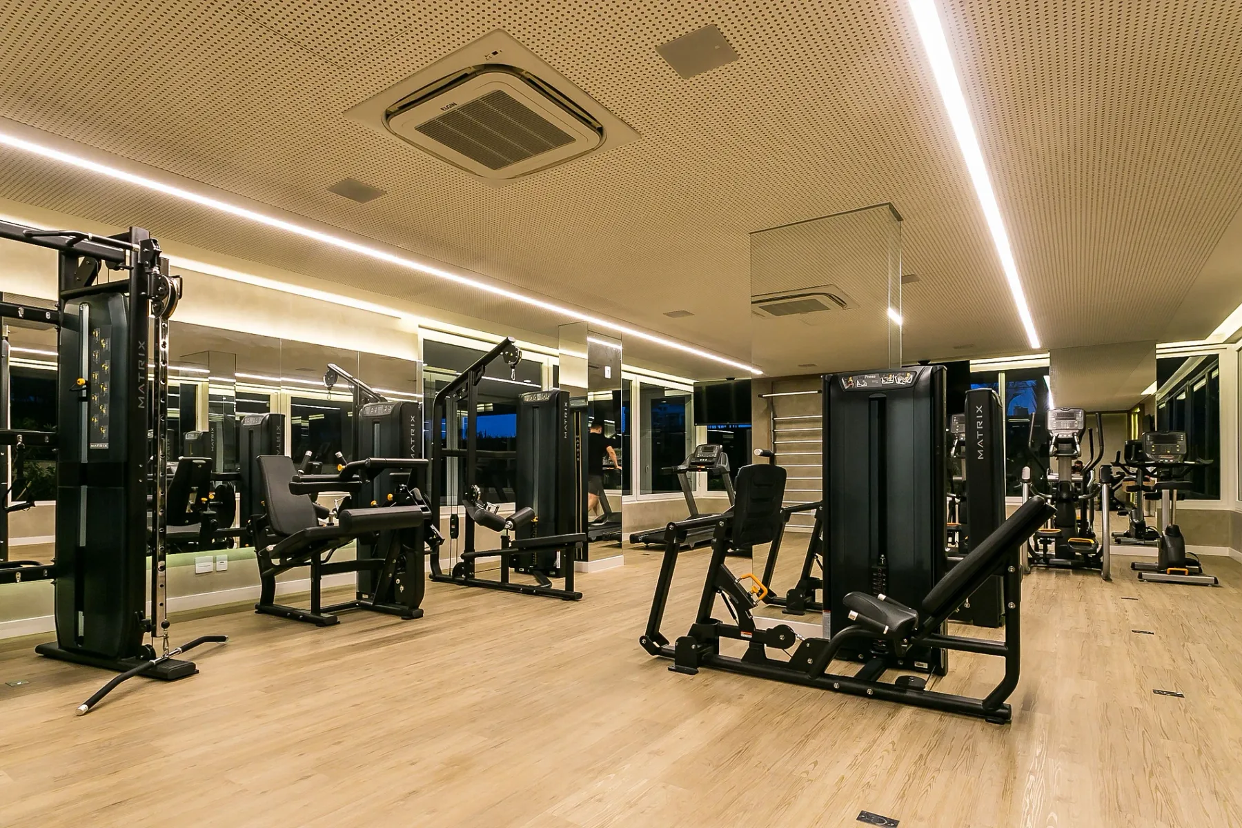 Shared amenity: A gym with exercise machines and weight-training equipment.