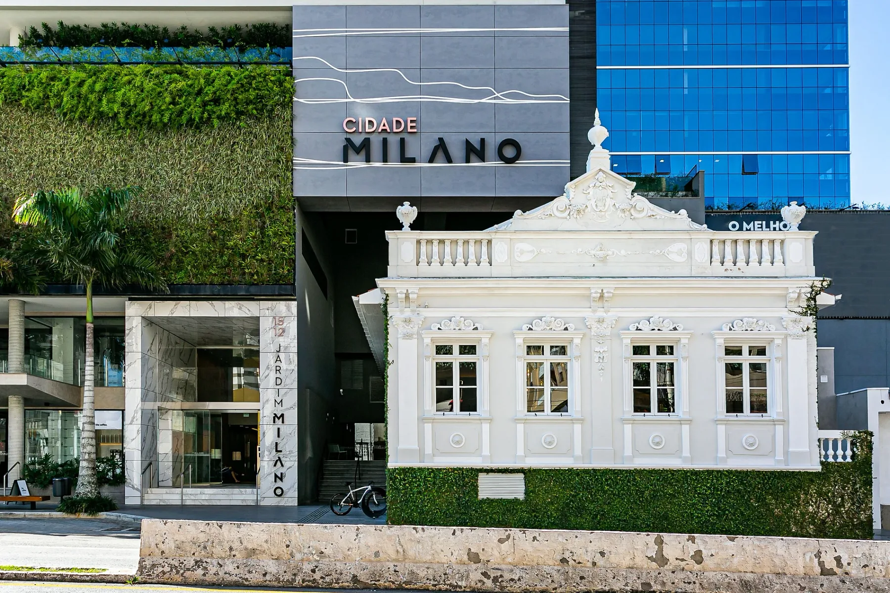 Shared amenity: Street view of contrasting building facades, including a white ornate facade.