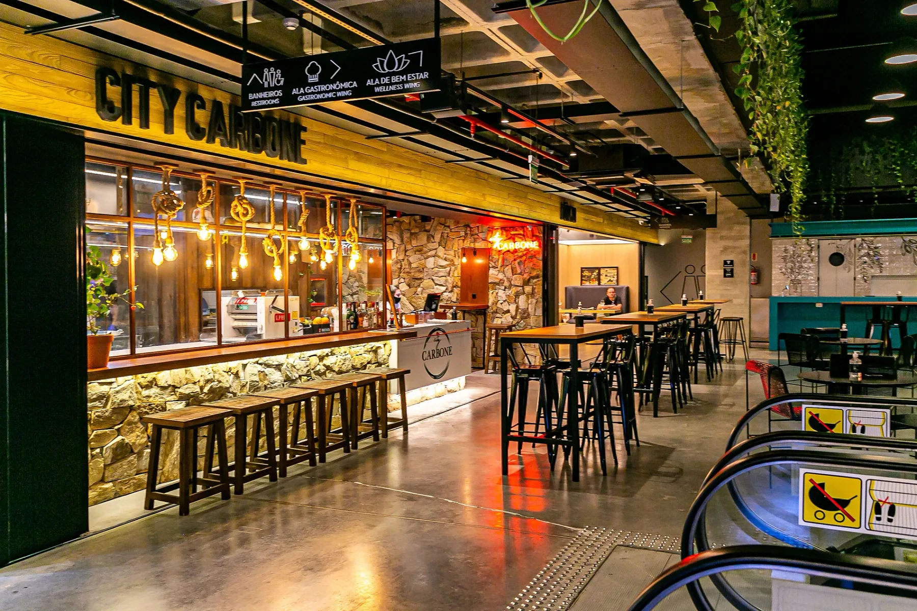 Shared amenity: A food court with counter seating and several tall tables.