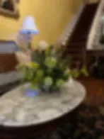Representative hotel space: A hotel sitting area has a floral arrangement on a round table.