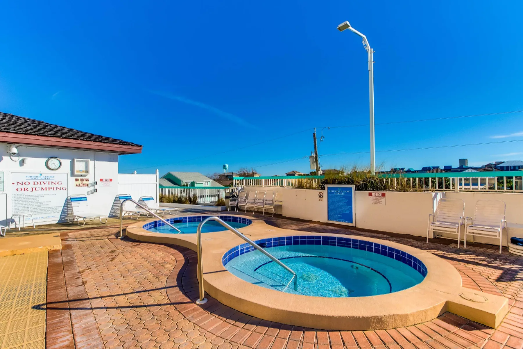 Shared amenity: An outdoor swimming pool with a smaller round pool beside it.