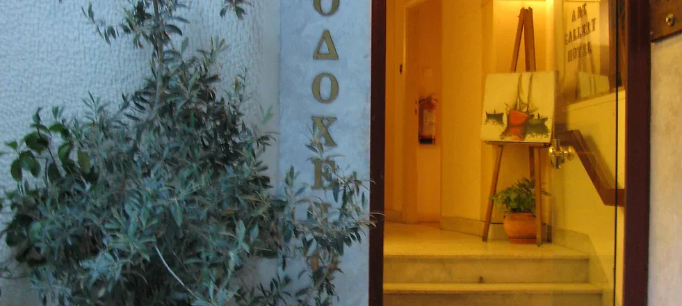 Representative hotel space: An illuminated hotel entrance opens onto a short set of steps.