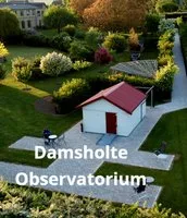 Representative hotel space: A small observatory building stands beside a landscaped garden.
