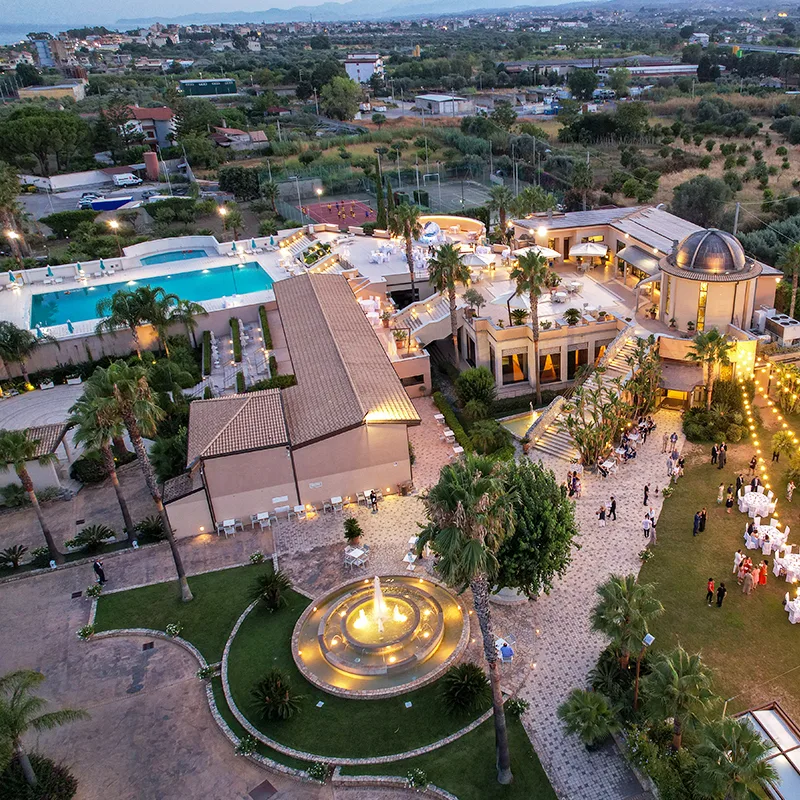 Representative hotel space: Aerial view of a hotel complex with a swimming pool and landscaped grounds.