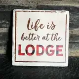 Representative hotel space: A wall sign reads “Life is better at the lodge.”