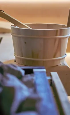 Representative hotel space: A wooden bucket and ladle sit on a counter.