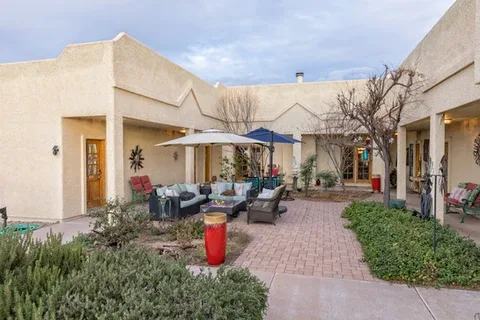 Representative hotel space: A hotel courtyard patio with outdoor seating and umbrellas.
