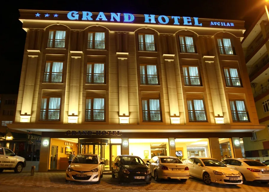Representative hotel space: The Grand Hotel facade is brightly illuminated at night.