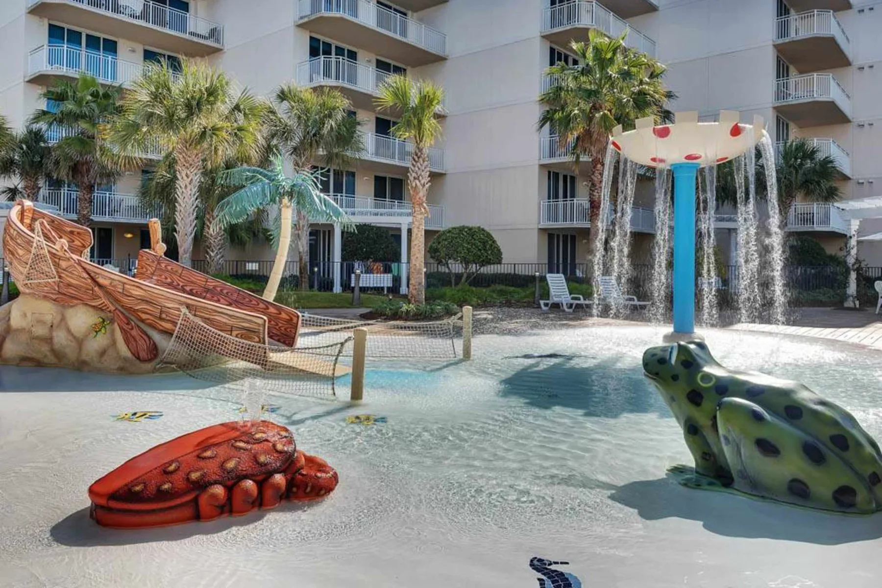 Shared amenity: A shallow pool with a colorful crab sculpture and a mushroom-shaped fountain.