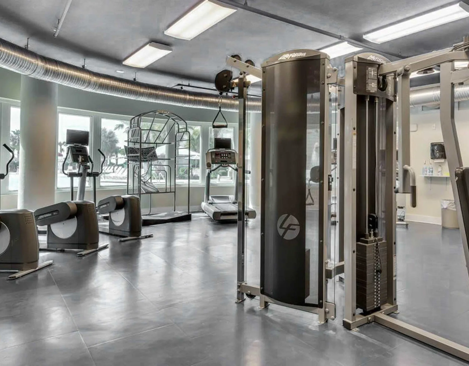 Shared amenity: A gym with exercise machines and weight-training equipment.