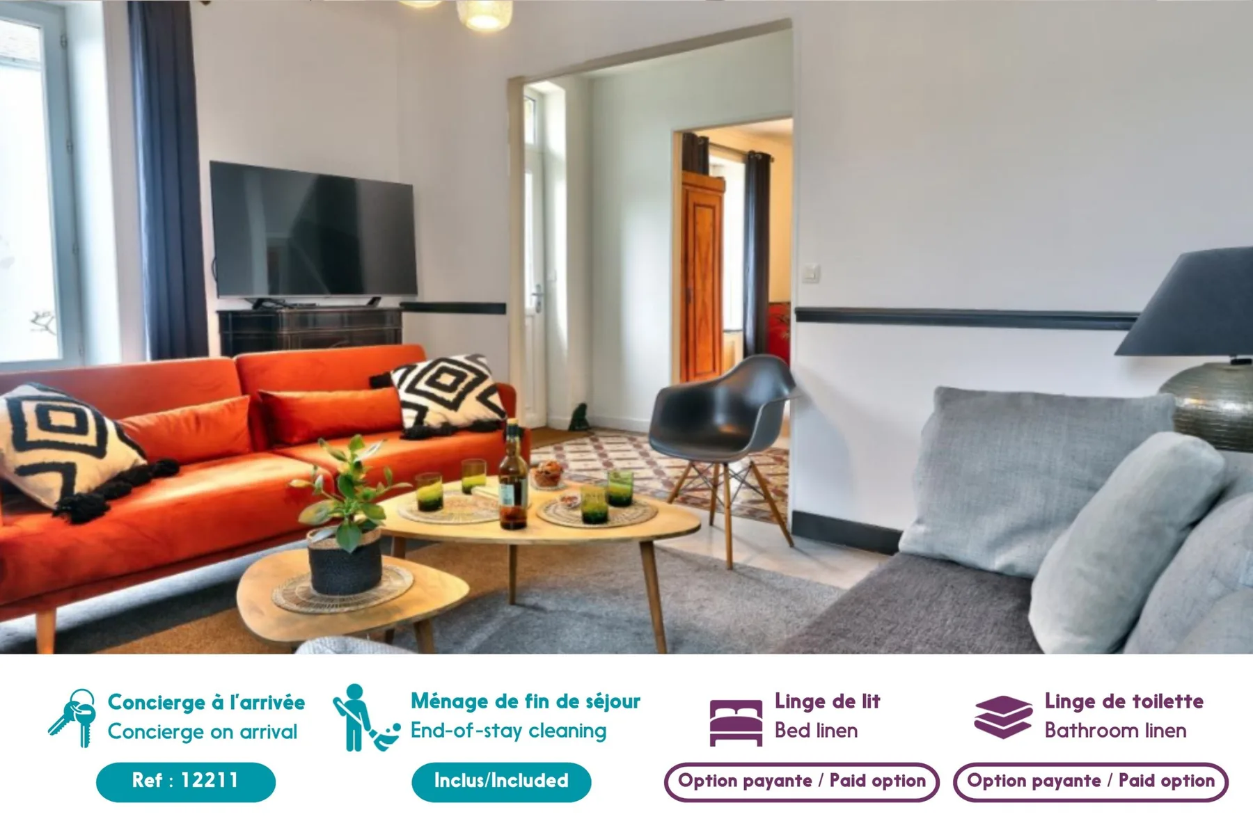 A living room with colorful seating, a coffee table, and a television.