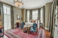 Representative hotel space: A living room with seating arranged around a small table.