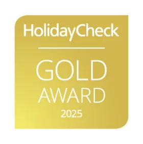 A gold HolidayCheck award badge displays the year 2025.