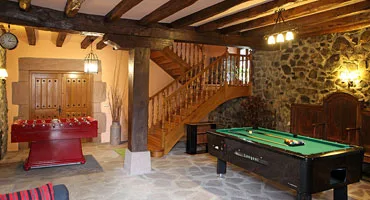 Representative hotel space: A game room with a pool table and a red table.