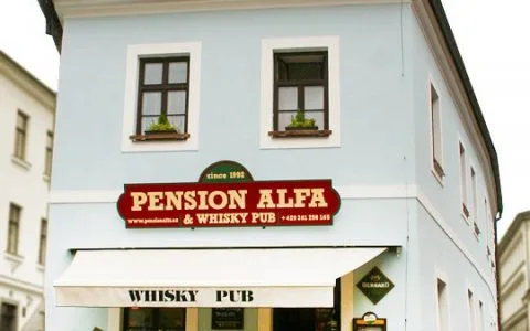 Representative hotel space: A pale blue building houses a pension and whisky pub.