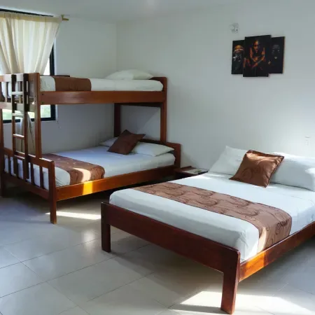 Representative hotel space: A bedroom with bunk beds and a separate bed.