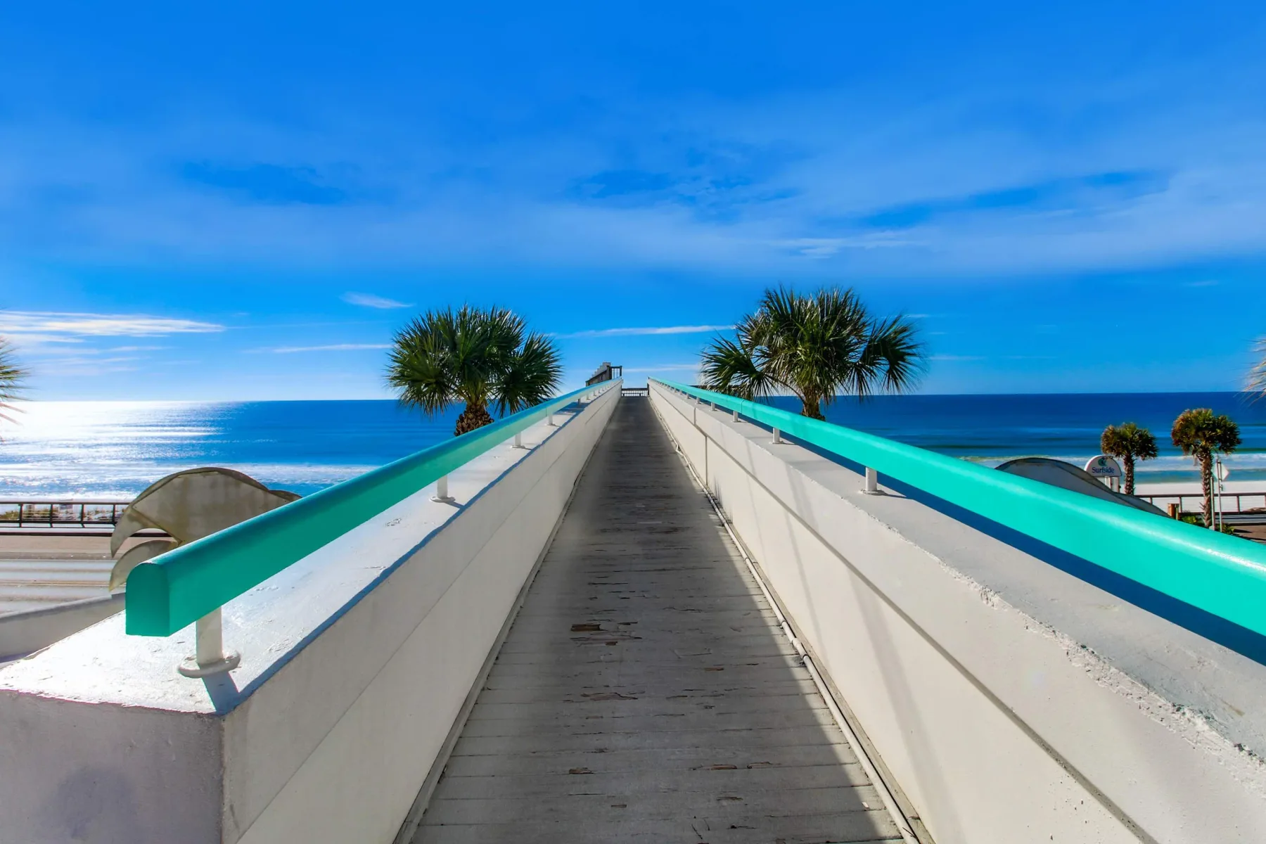 Shared amenity: A raised seaside walkway leads toward the ocean.