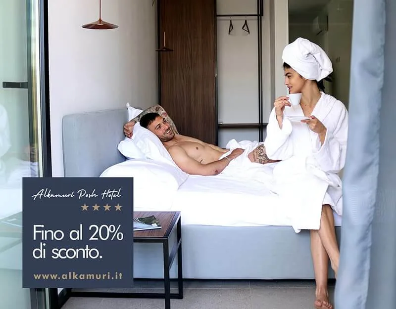Representative hotel space: A hotel bedroom with a couple relaxing on the bed.