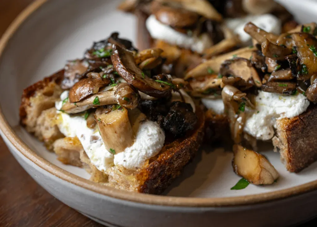 Representative hotel space: A plate of toast topped with mushrooms and soft white cheese.