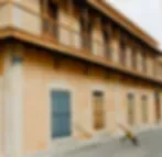 Representative hotel space: Exterior view of a building with a row of windows along the facade.