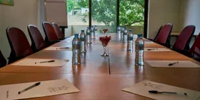 Representative hotel space: A conference room with a long table and chairs arranged around it.