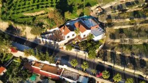 Representative hotel space: An aerial view shows a building surrounded by trees and landscaped grounds.