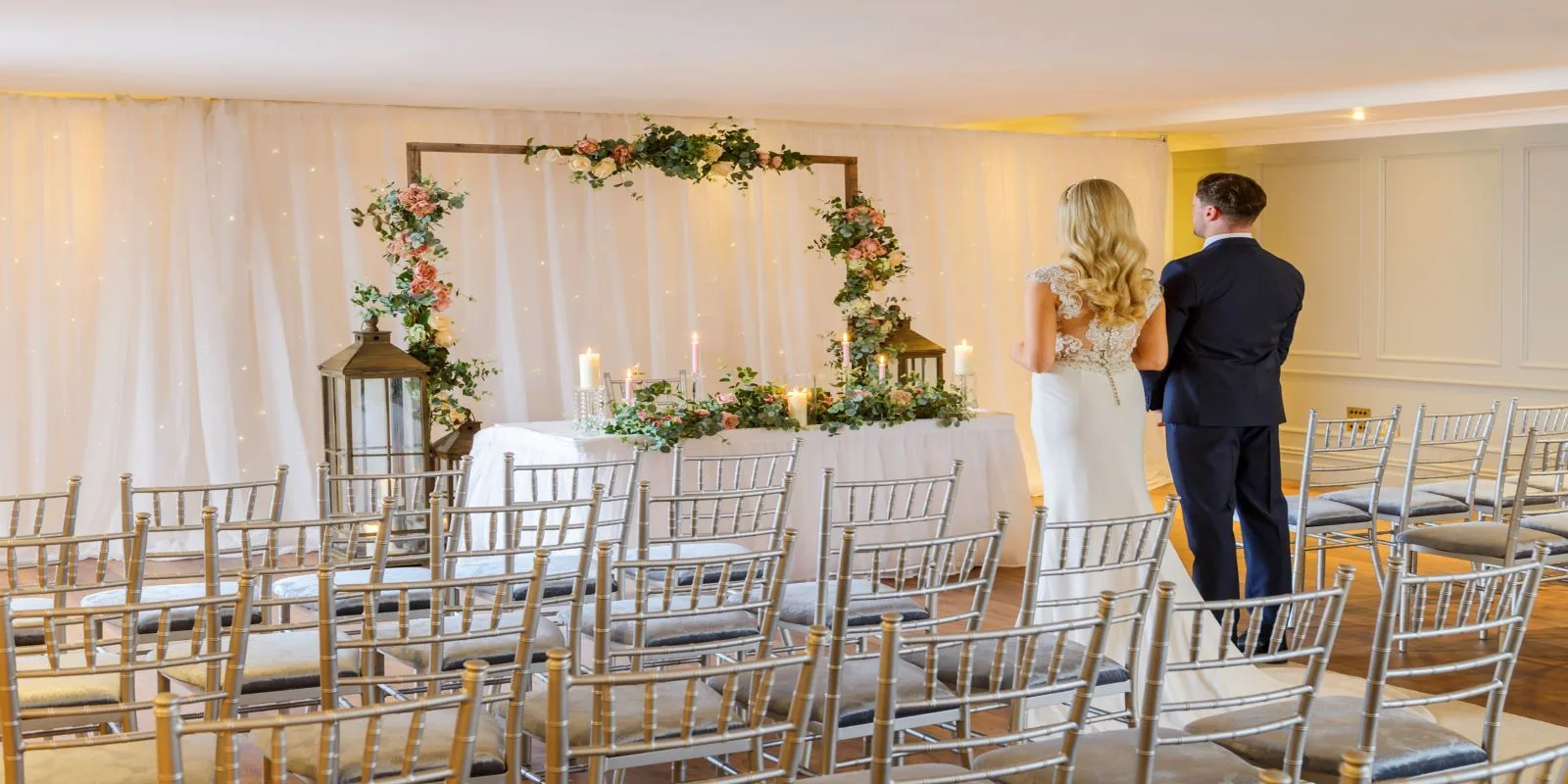 Representative hotel space: A wedding ceremony setup with rows of chairs facing a flower-decorated backdrop.