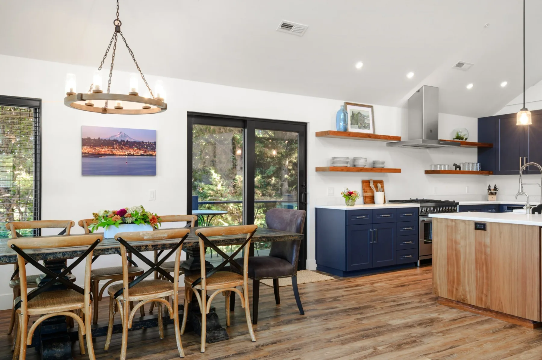 Representative hotel space: An open kitchen and dining area with a table beside the kitchen island.