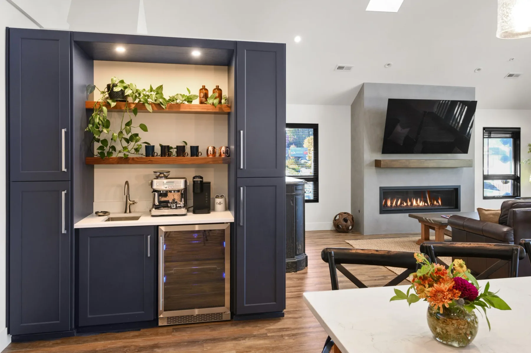 Representative hotel space: A lounge seating area with a fireplace and a built-in beverage counter.
