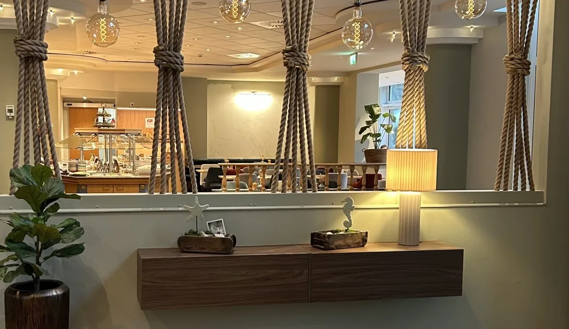 Representative hotel space: A hotel reception area with a counter and pendant lights.