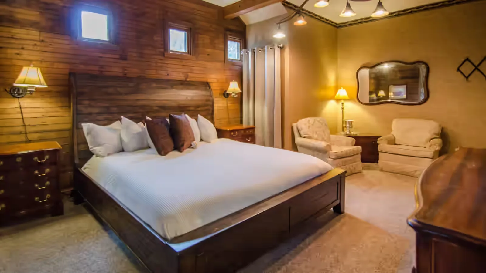 Representative hotel space: A bedroom with a large bed and upholstered seating.