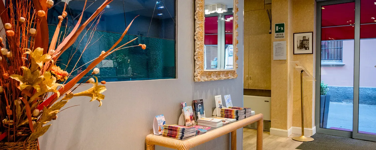 Representative hotel space: A hotel lobby with a display table and colorful floral arrangement.