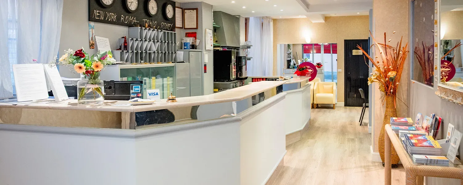 Representative hotel space: A hotel reception desk with key racks and a seating area.