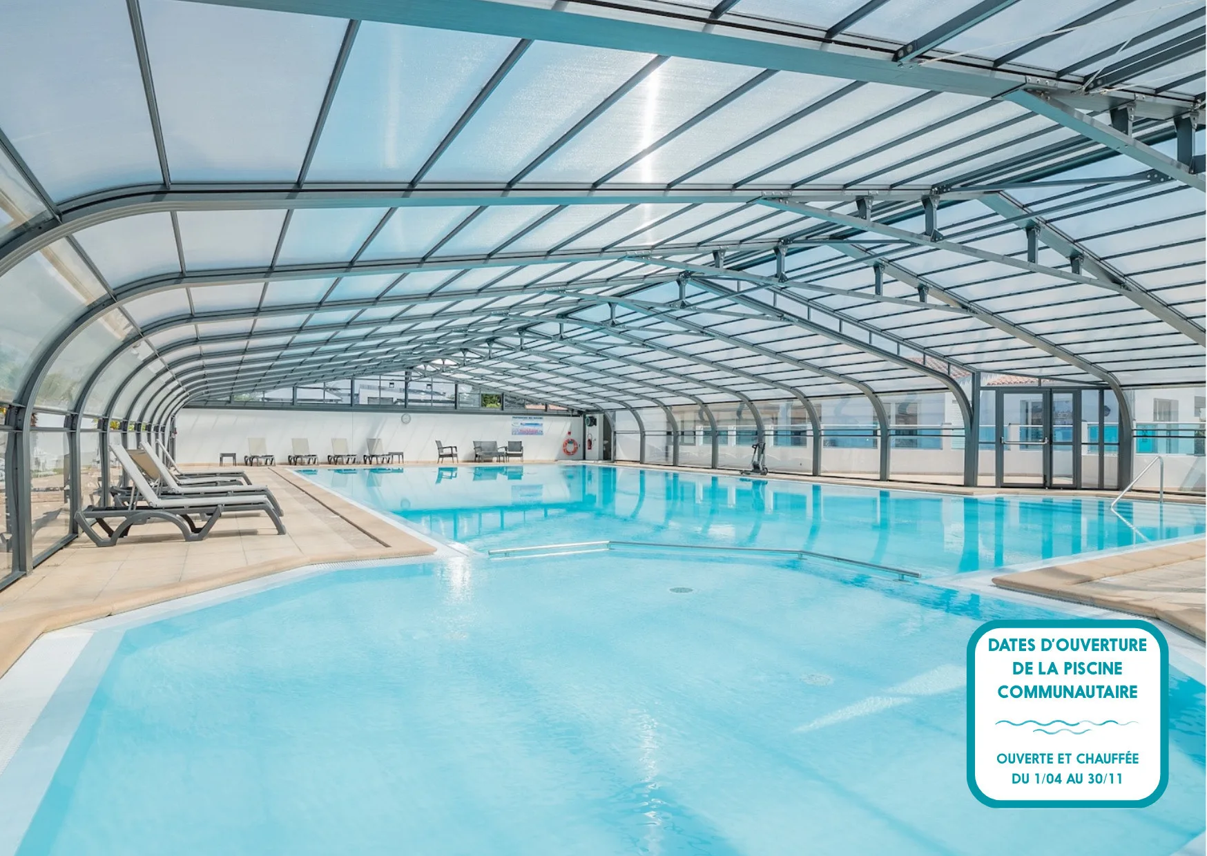 Shared amenity: A covered swimming pool with lounge seating along the edge.