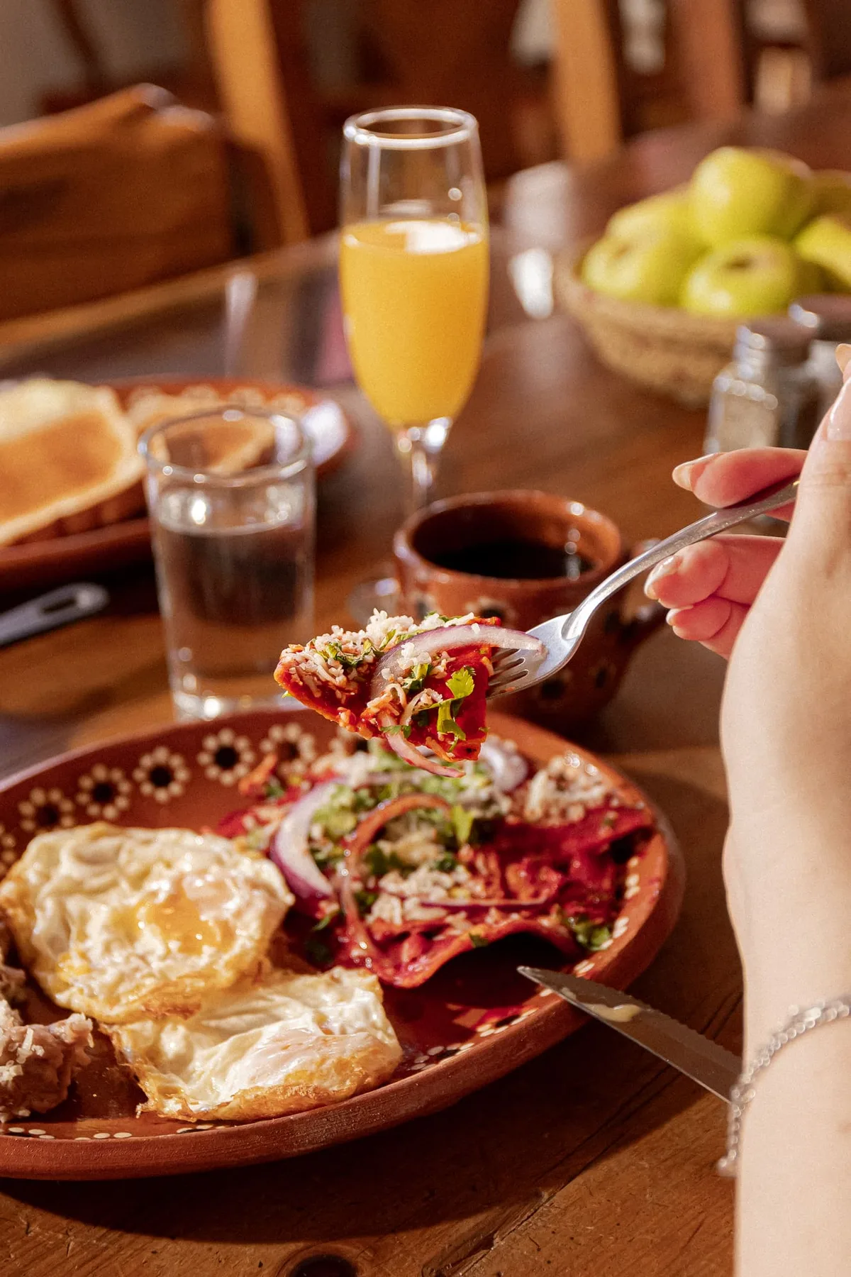 Representative hotel space: A breakfast plate with eggs and garnishes sits on a dining table.