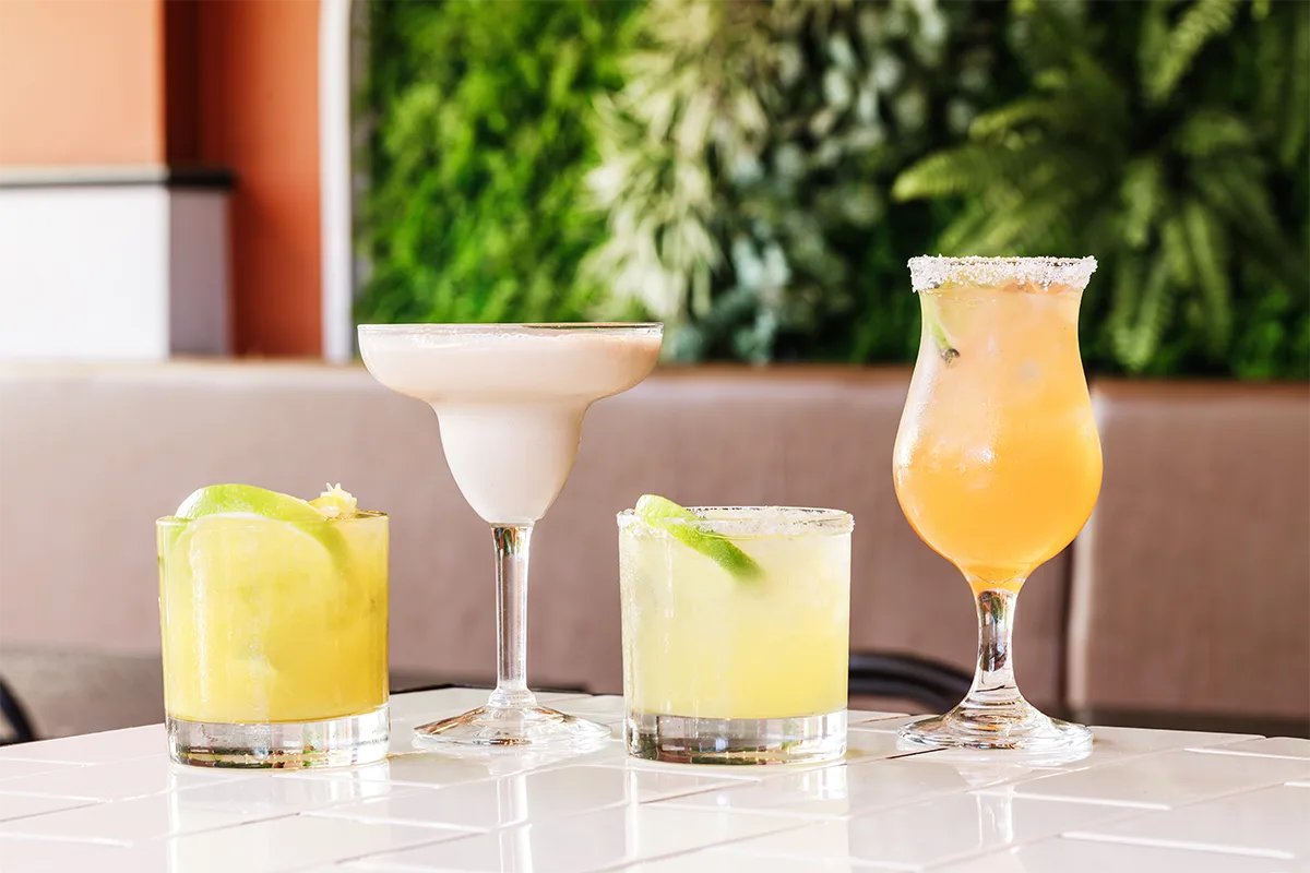 Representative hotel space: Drinks on a tiled table in an outdoor seating area.