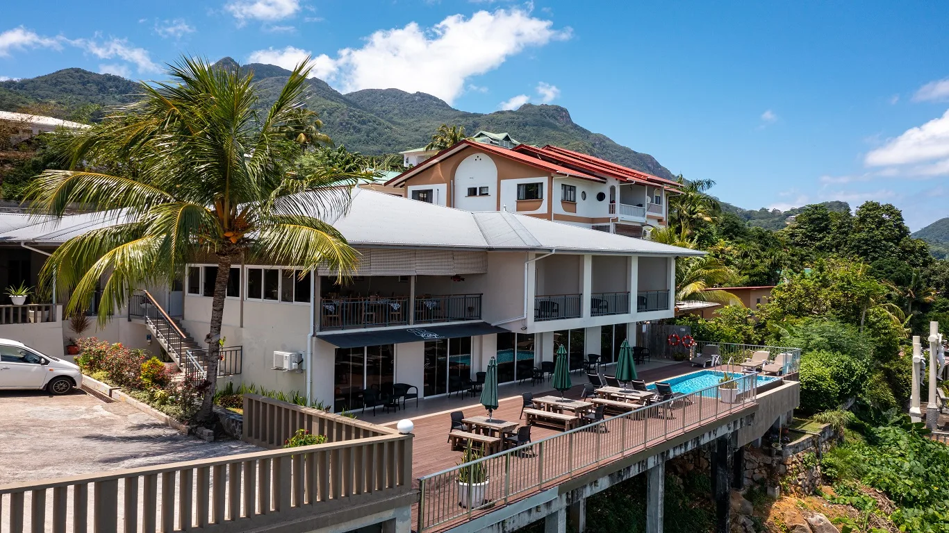 Representative hotel space: A multi-story building with an outdoor terrace and swimming pool